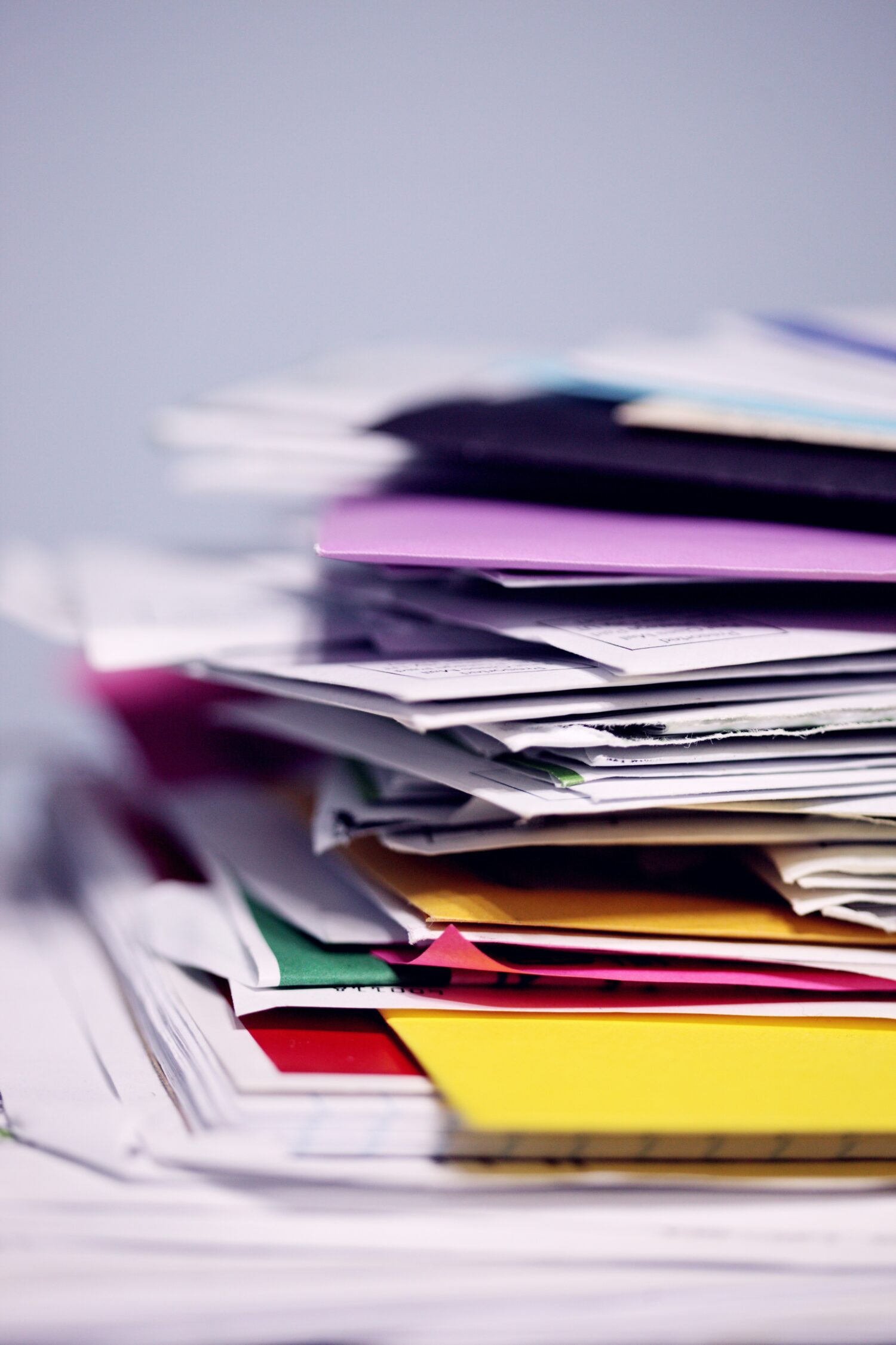 Stack of different coloured envelopes
